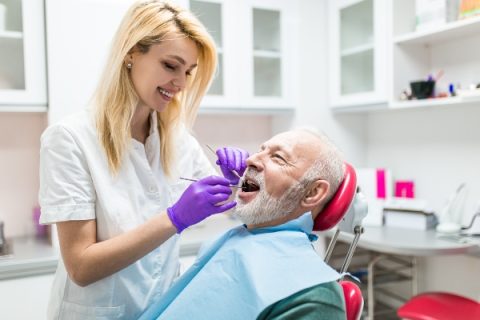 Dental hygienist cleaning a patient’s teeth in Whittier, CA