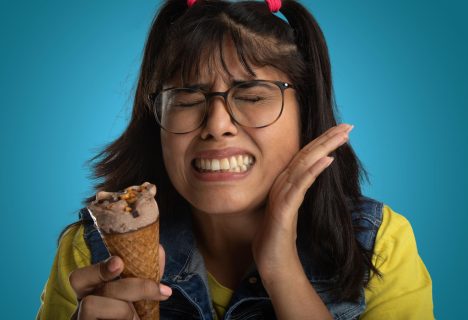 Patient experiencing tooth pain when eating sweets during dental exam in Whittier CA